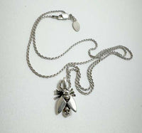 Fly with Baby Head Abdomen Necklace