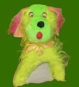 Green plush dog toy with pink hair on a green background