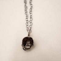 Baby Eating a Rat Necklace