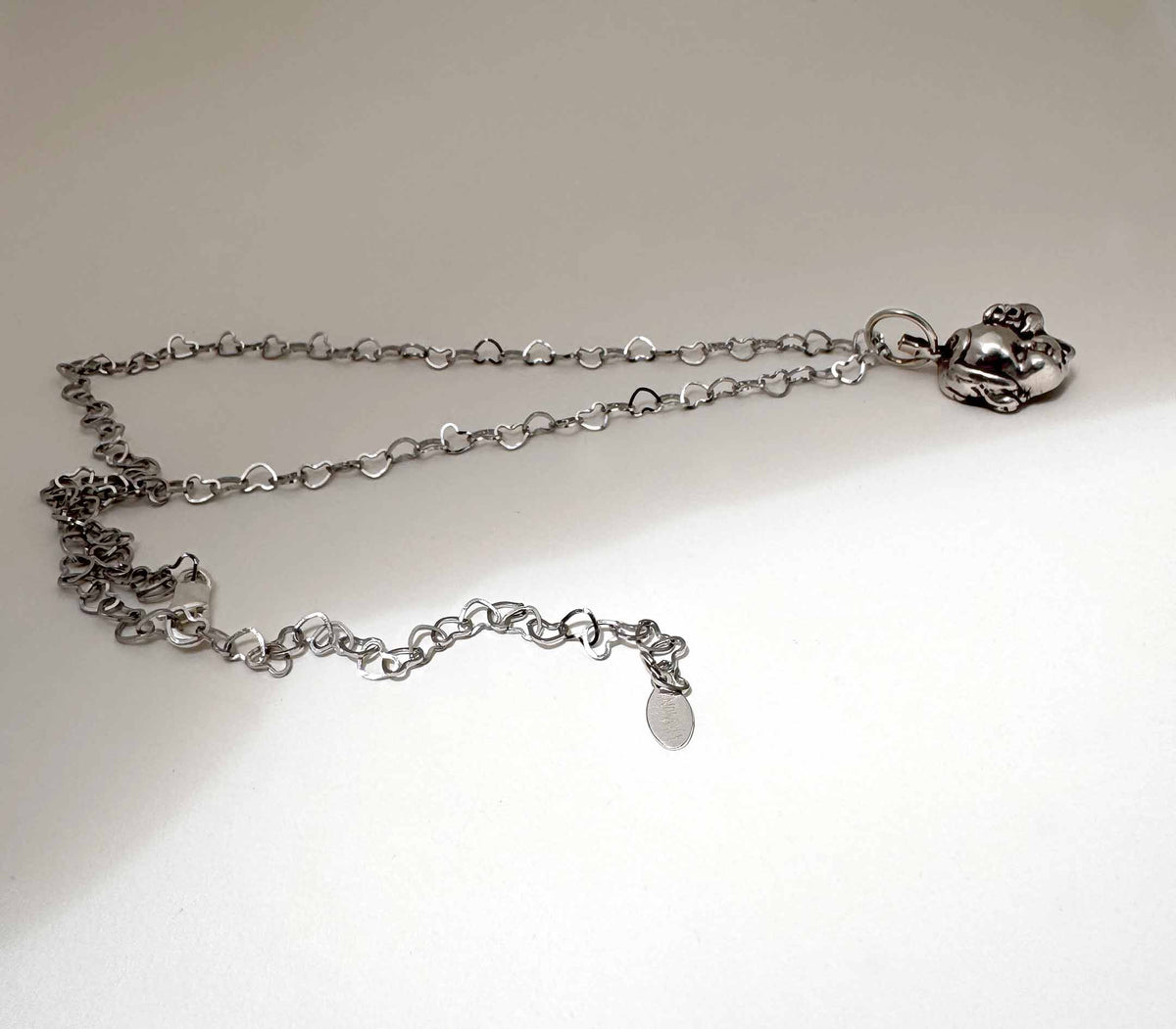 Baby Eating a Rat Necklace