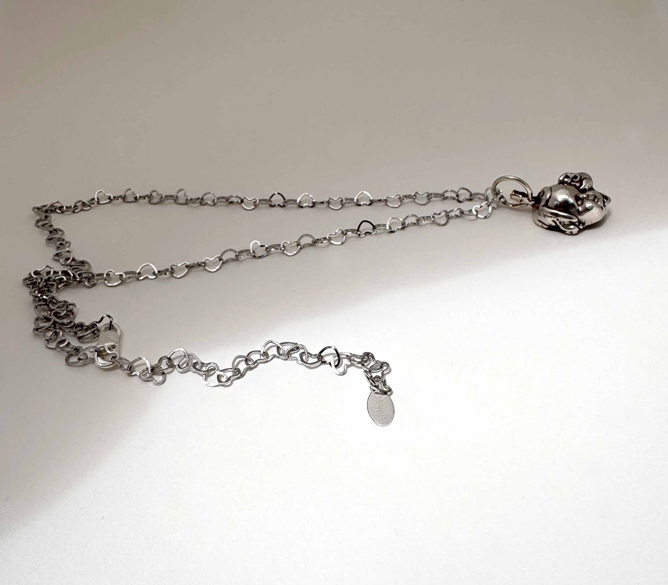 Baby Eating a Rat Necklace