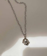 Baby Eating a Rat Necklace