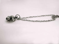 Baby Eating a Rat Necklace