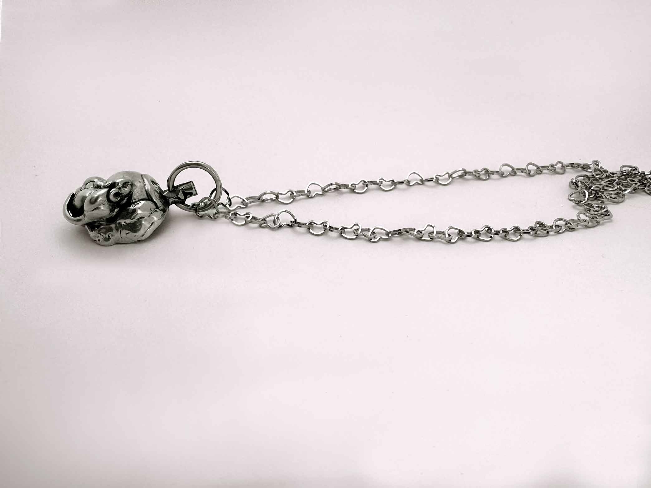 Baby Eating a Rat Necklace