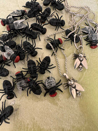 Fly with Baby Head Abdomen Necklace