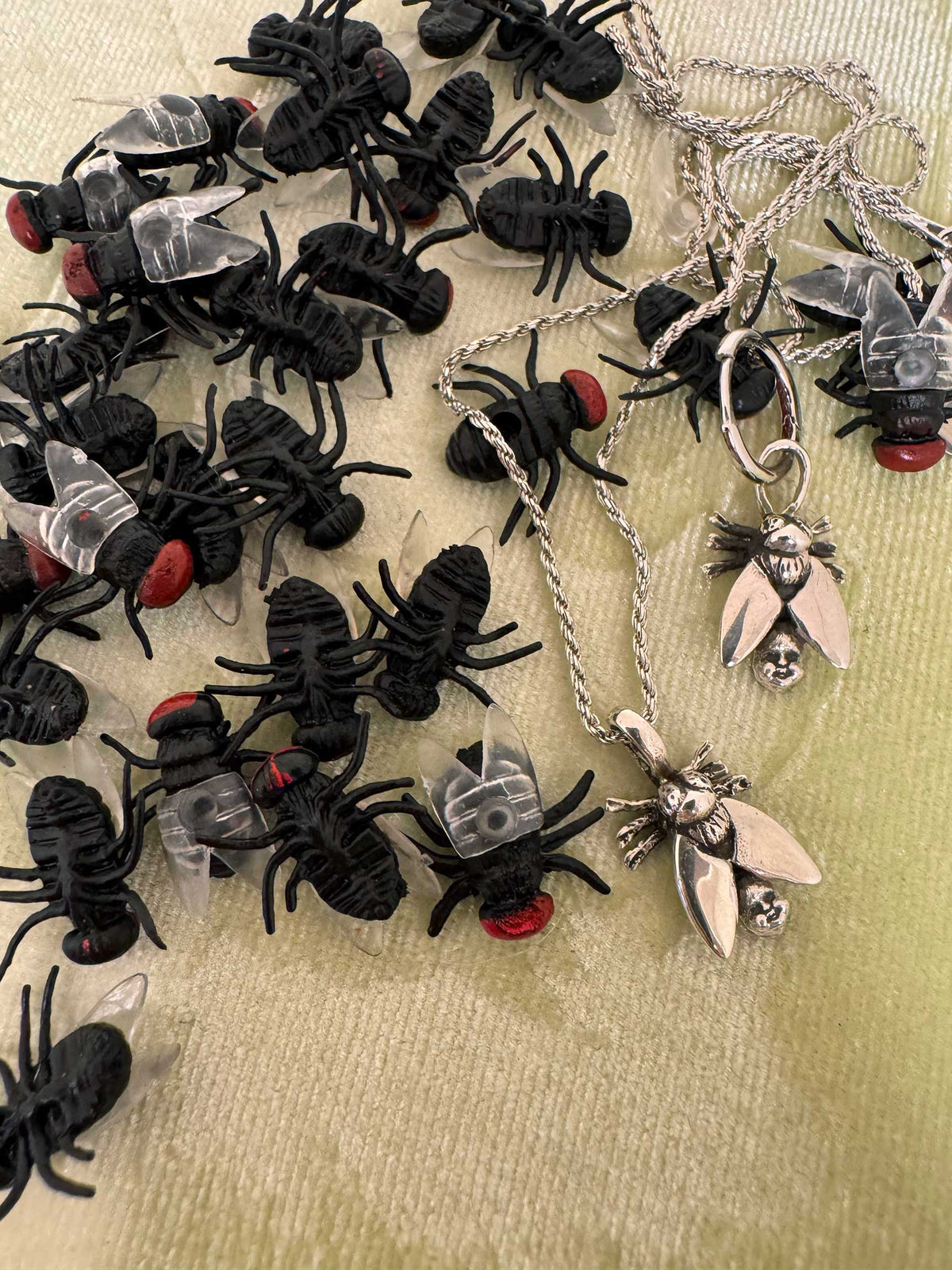 Fly with Baby Head Abdomen Necklace