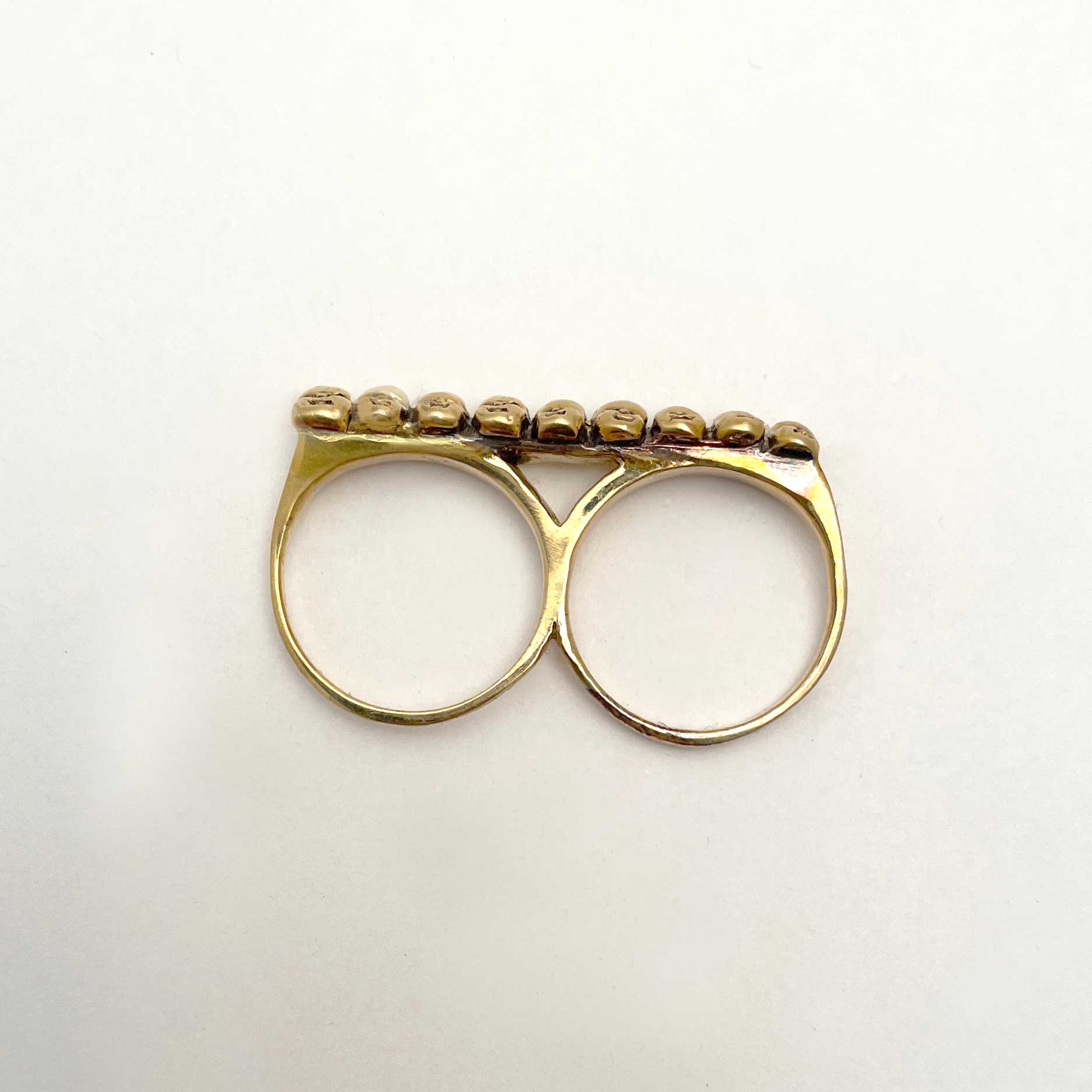 Baby Heads Knuckle Ring – Anomaly
