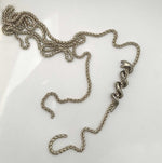 silver serpent snake coiled around chain 