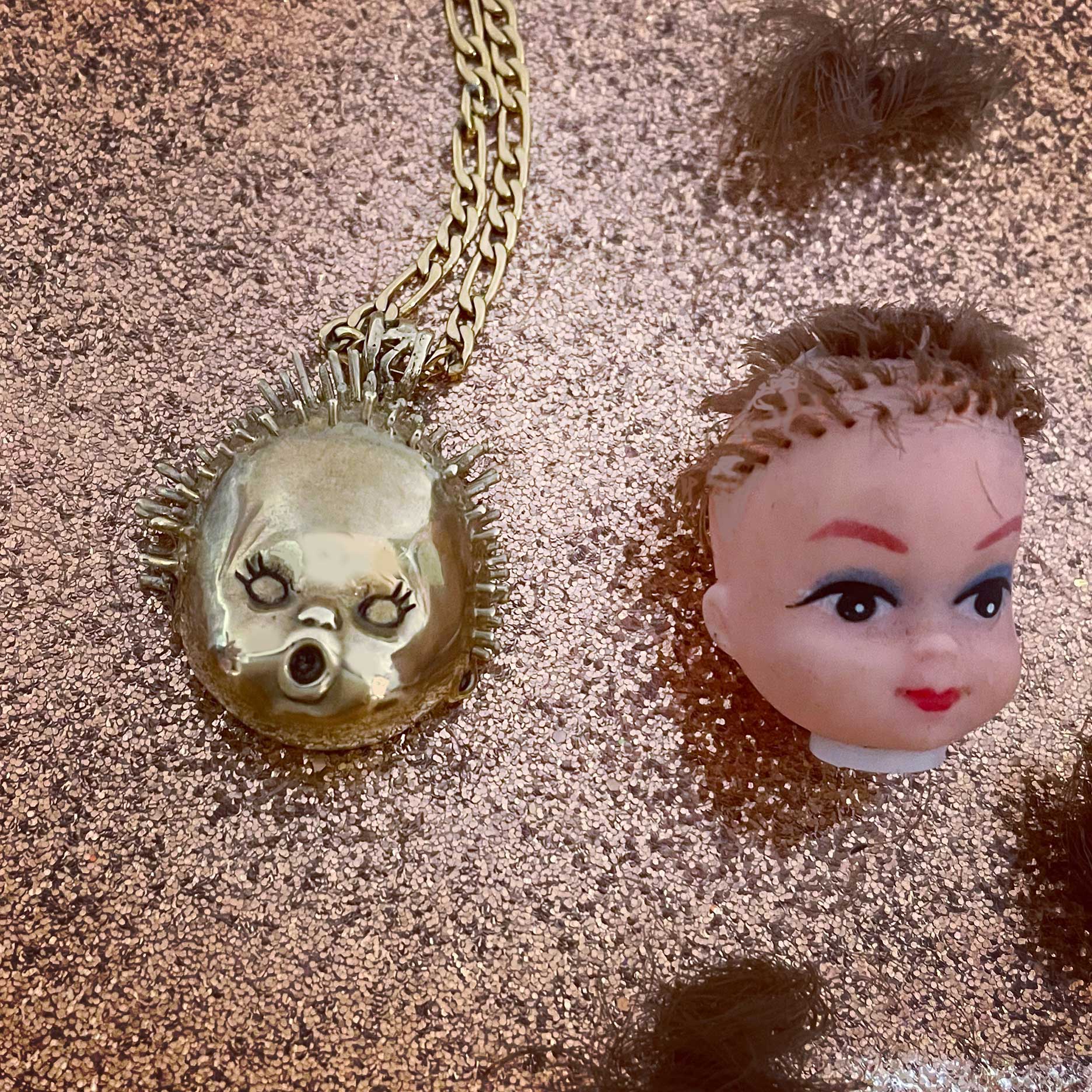 Baby Doll Head Haircut Mishap Necklace - Main Image