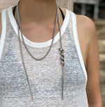 model wearing silver serpent snake coiled around chain necklace